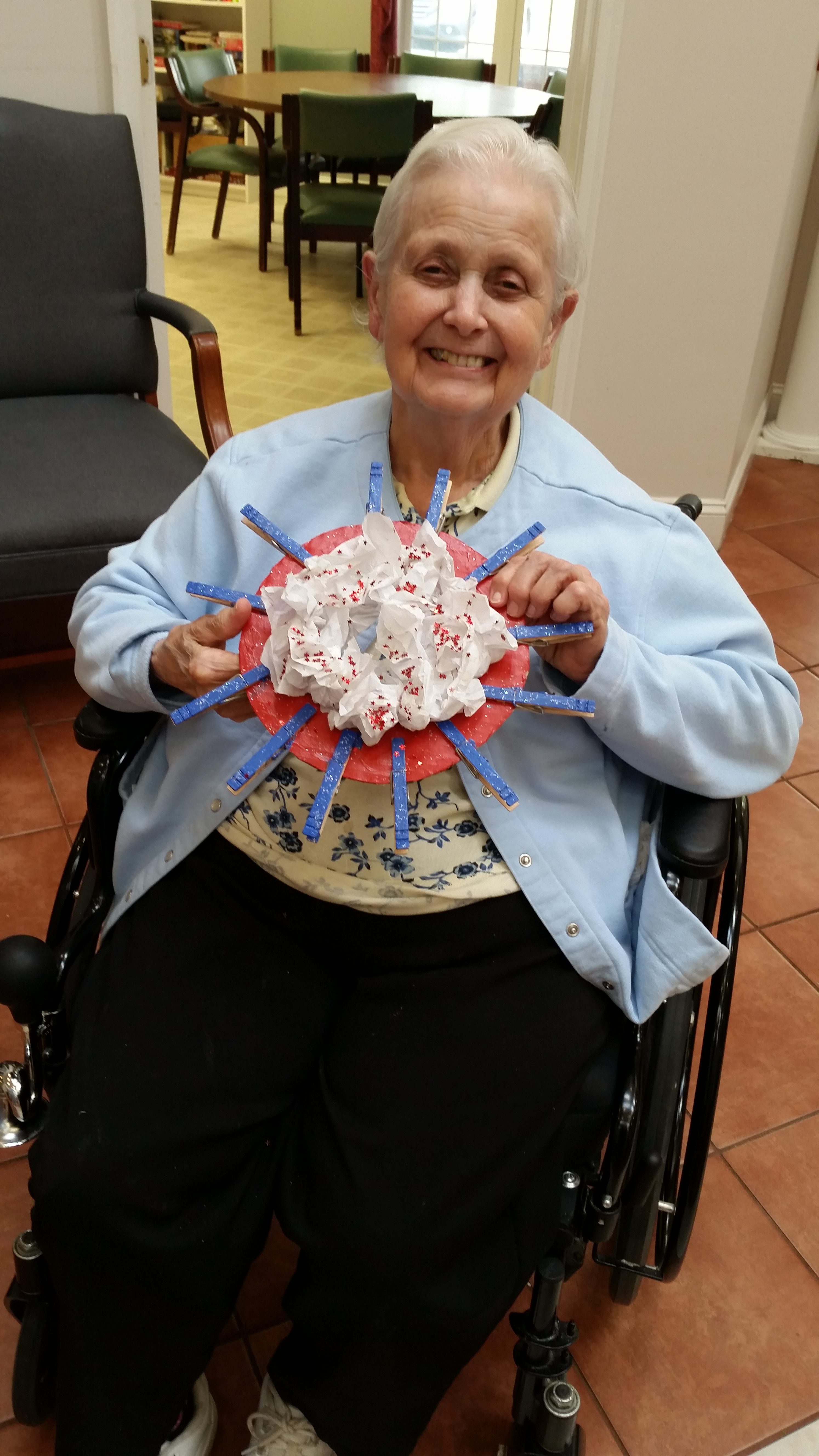 woman smiling with patriotic wreath