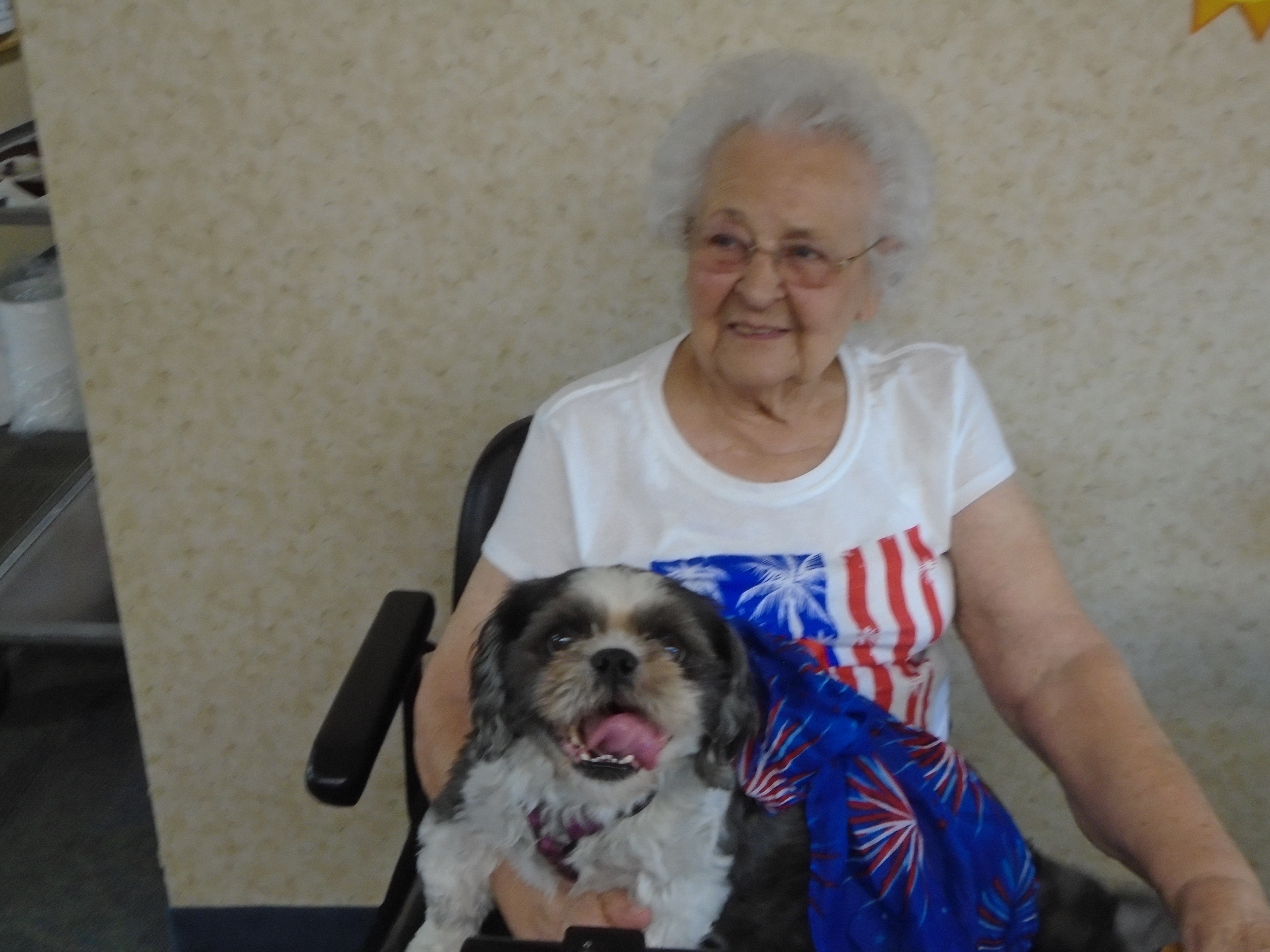 woman smiling with small dog