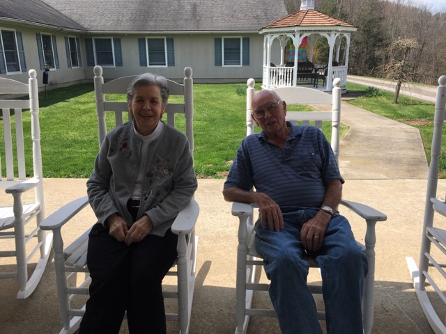 couple sitting in rocking chairs