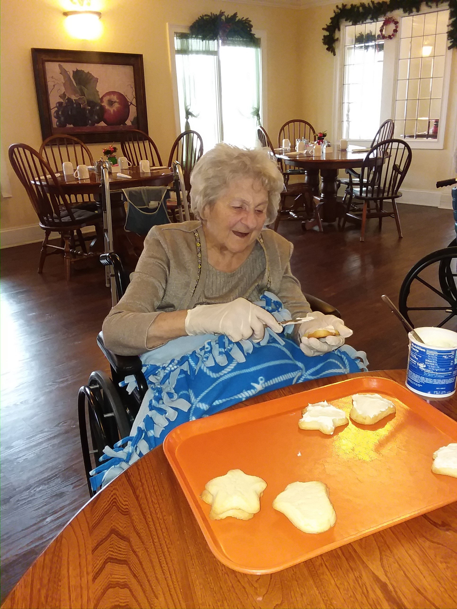 woman frosting cookies
