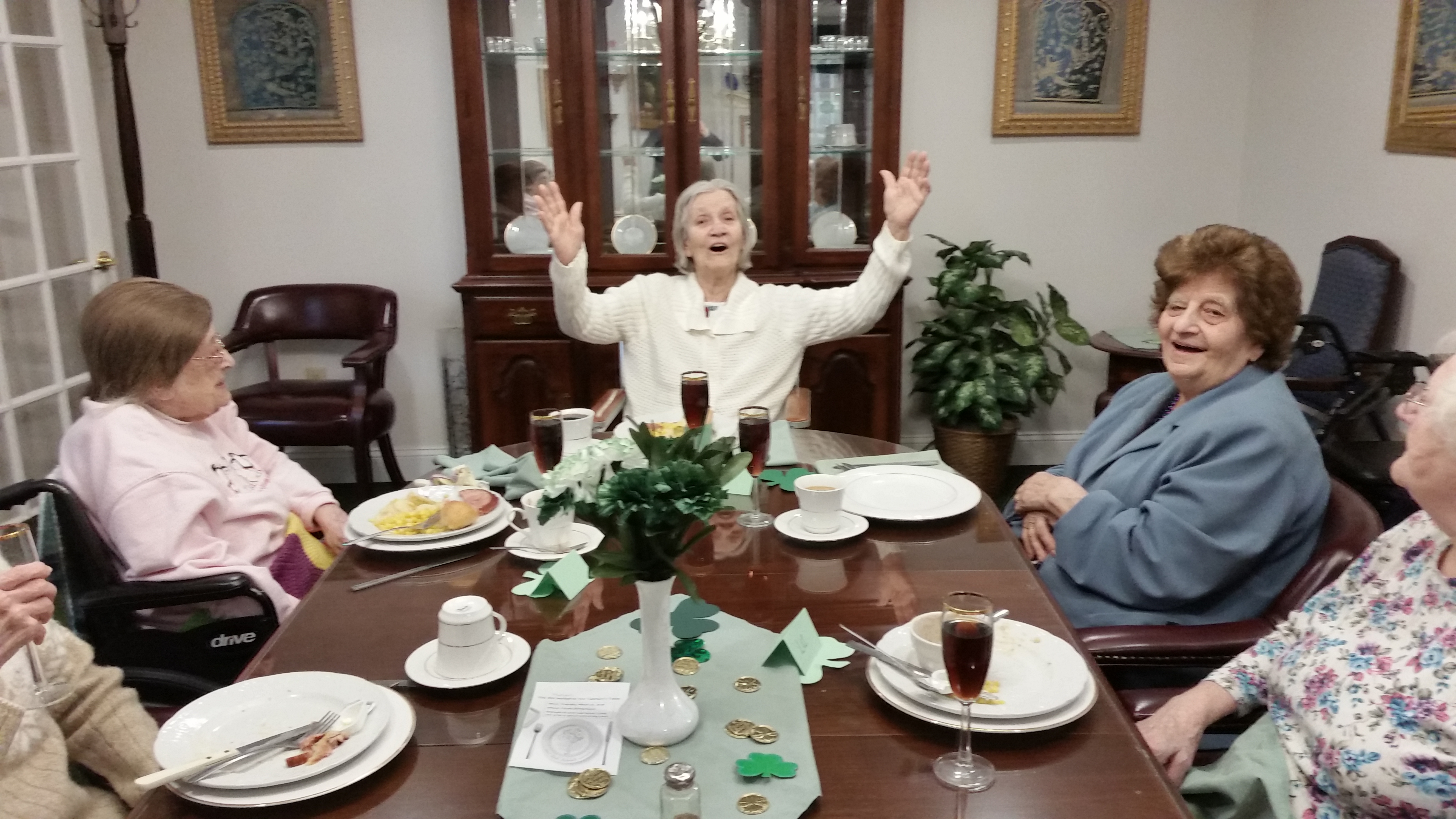 group laughing at dinner table
