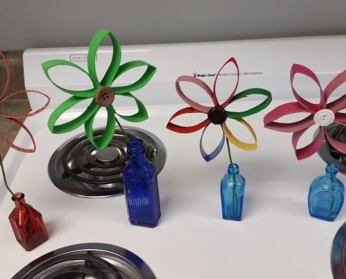 toilet paper roll flowers in bottles