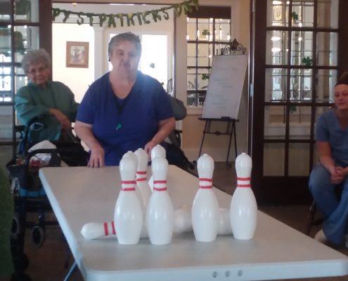 woman bowling with potato