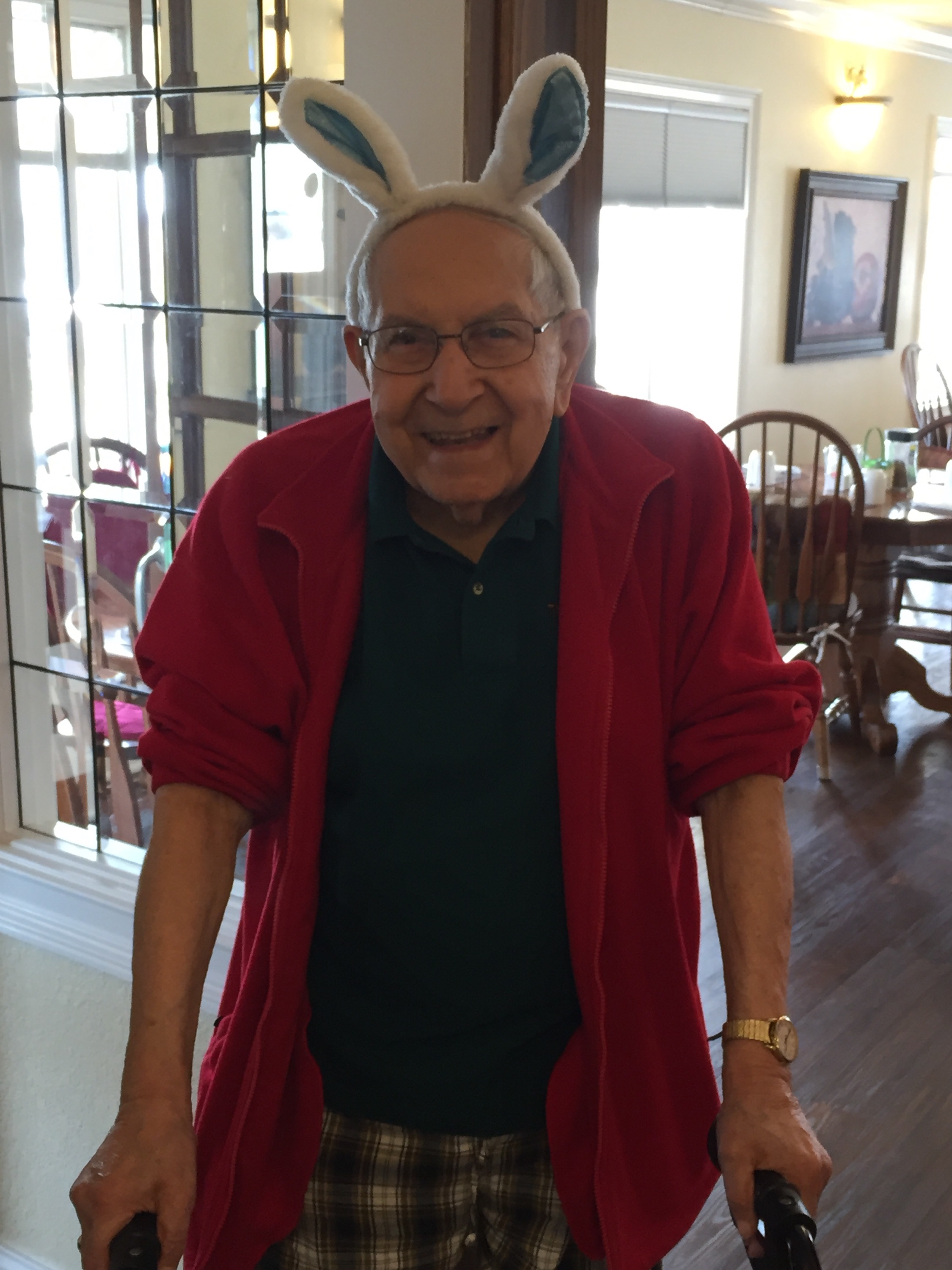 man with rabbit ears smiling at camera