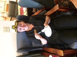 woman smiling and eating cake