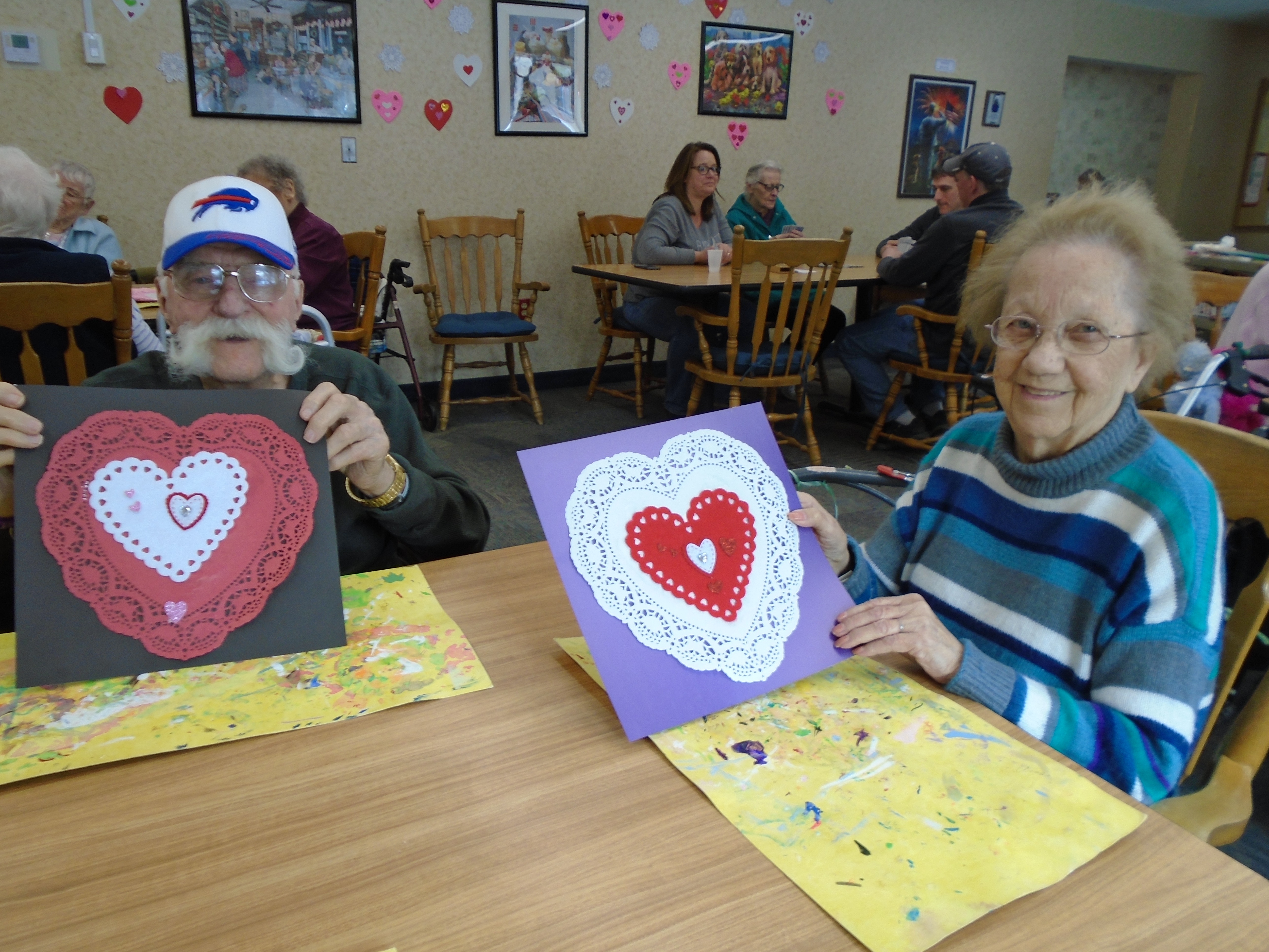 couple smiling with valentine's day decorations