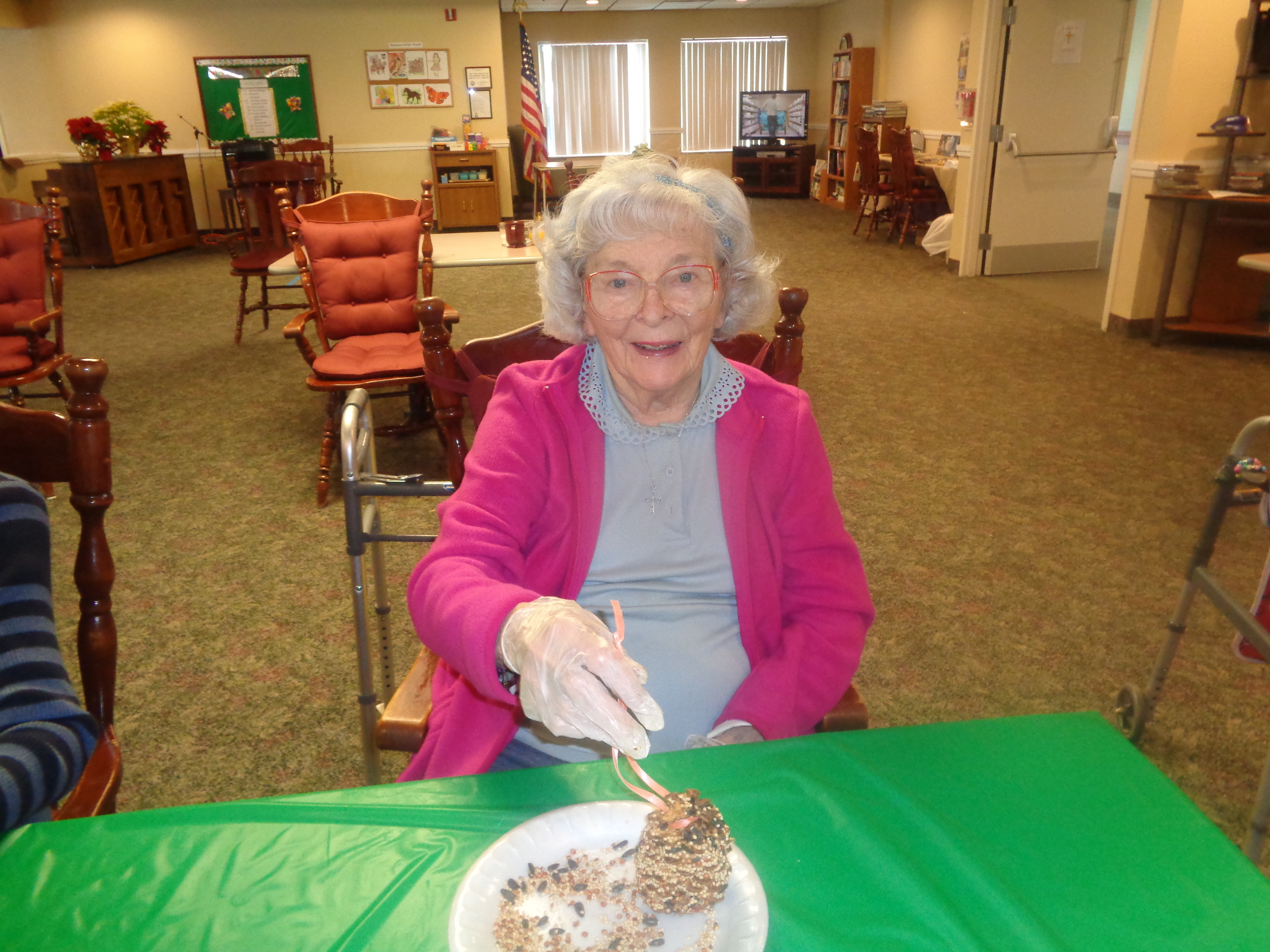 woman making bird feeder