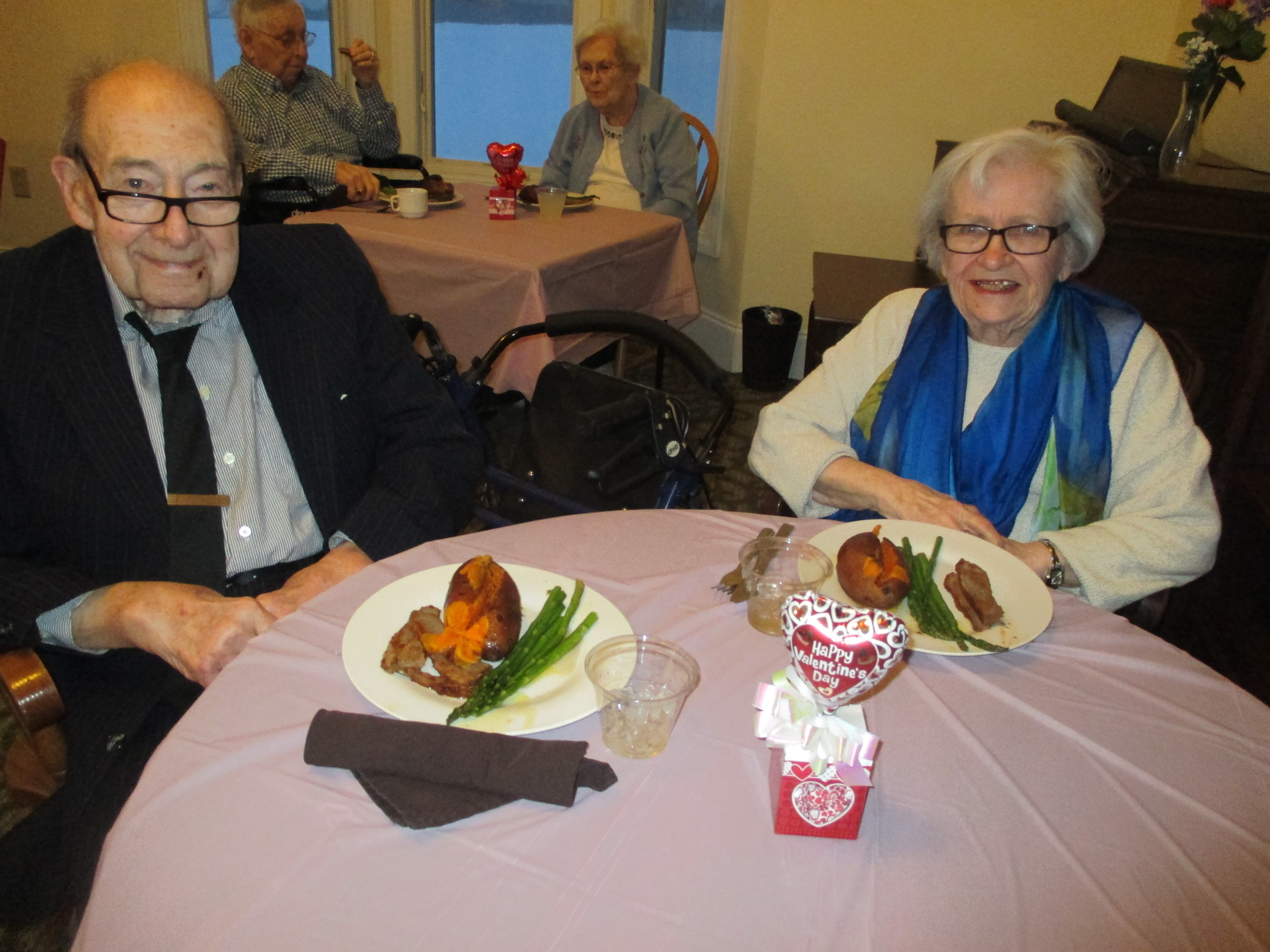 couple smiling at dinner party