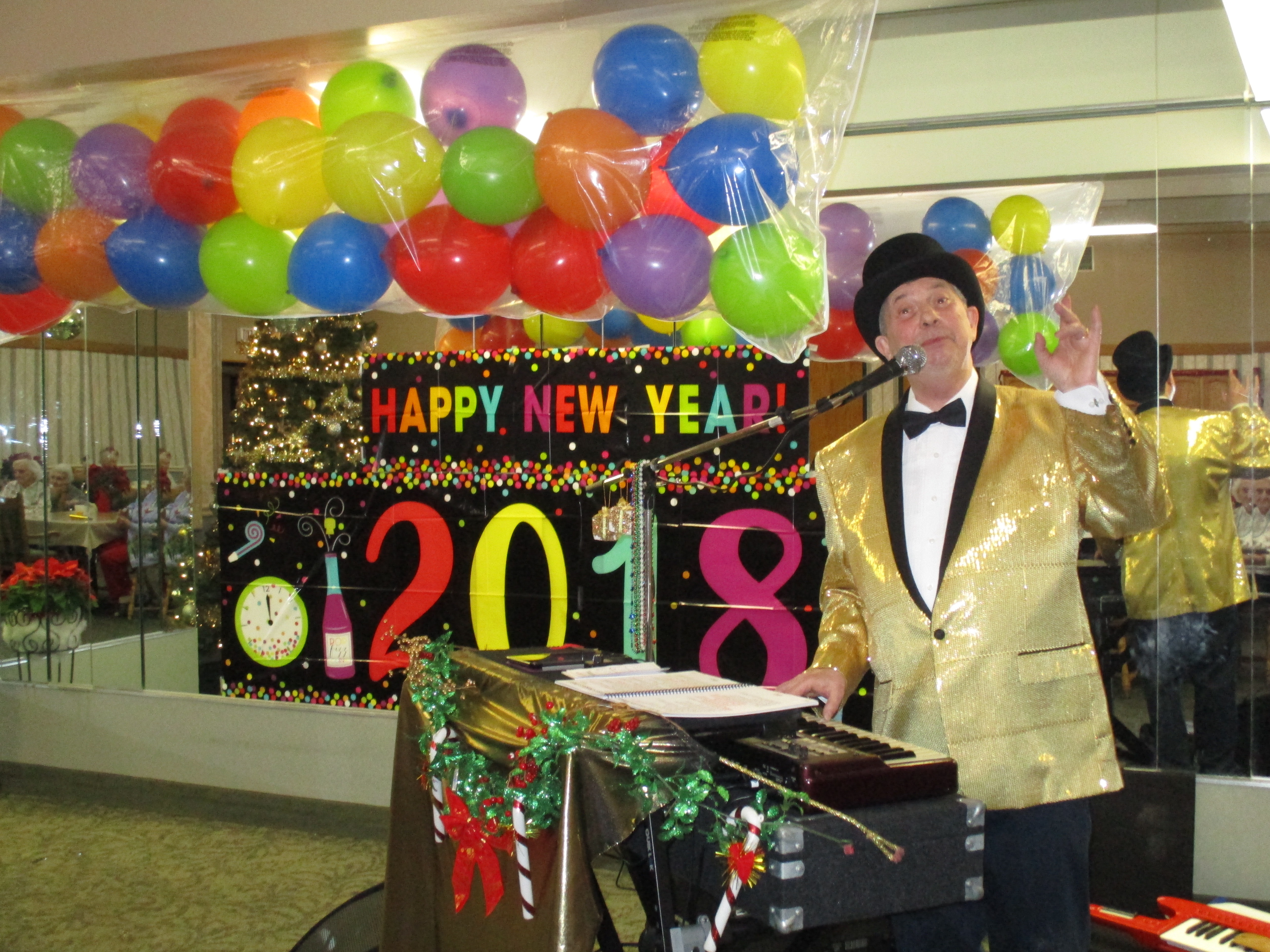 man singing and playing piano at new year's celebration