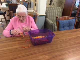 woman making key chain