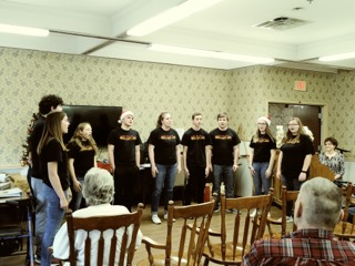 Choir performing for residents
